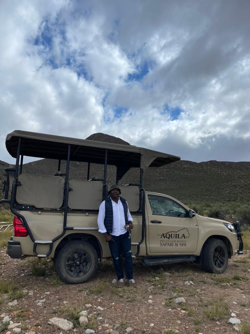 Professional tour guide with safari vehicle